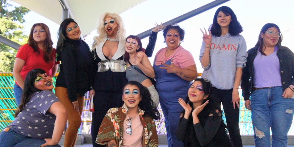 Image of instructor and students from a drag makeup class